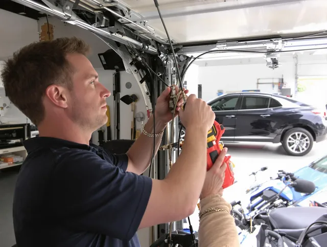 Torrington Garage Door Repair safety certified technician performing cable replacement in Torrington