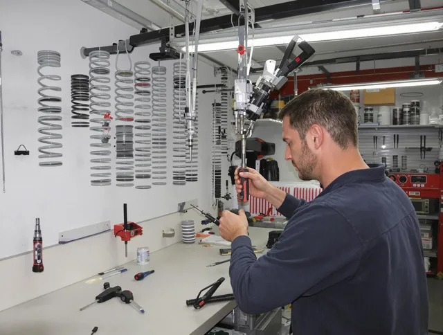 Torrington Garage Door Repair safety certified technician performing precision spring replacement in Torrington